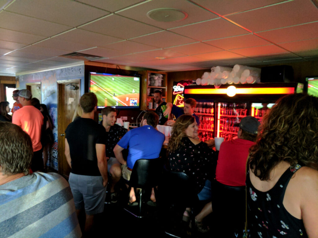 A graphic of guests in the Annex sitting on bar stools next to TVs playing a baseball game