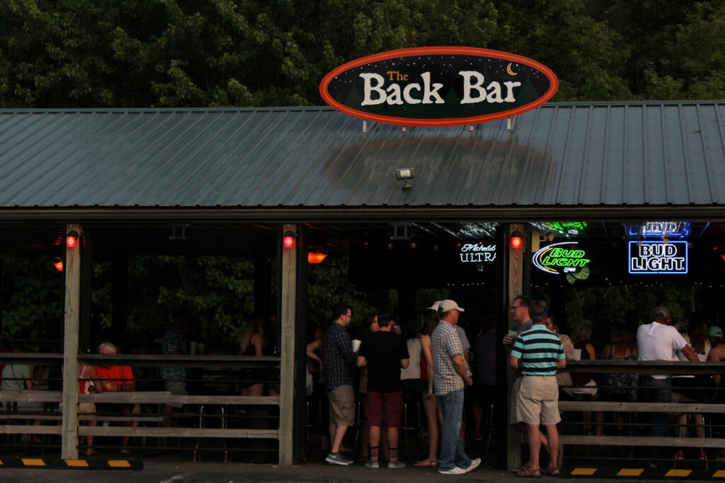a graphic of guest standing outside the entrance of the Back Back