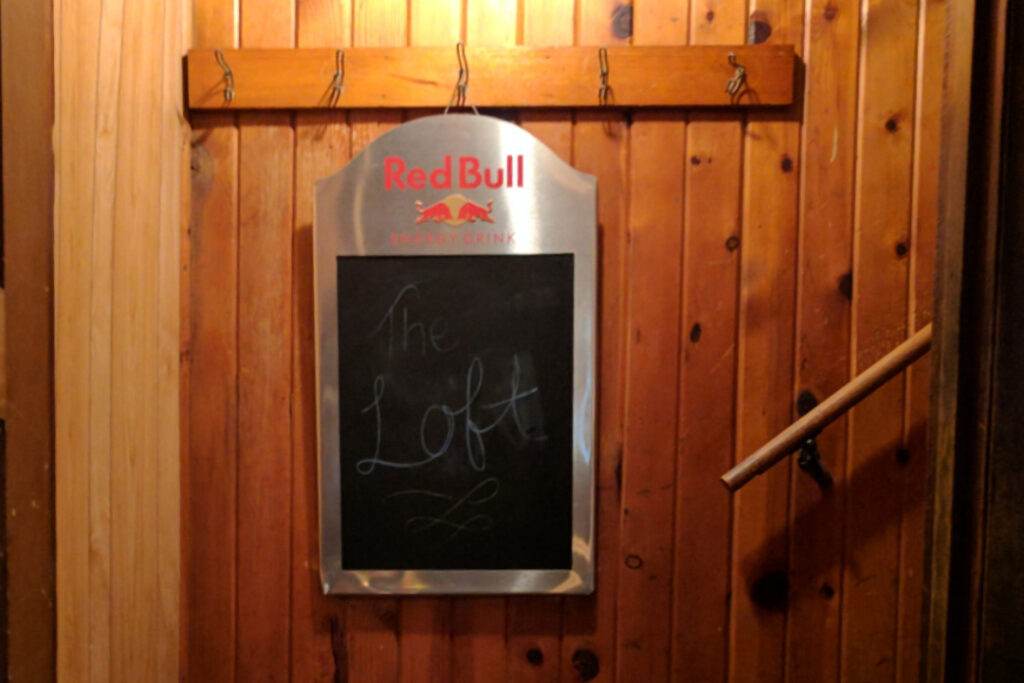 A graphic of a sign marking The Loft