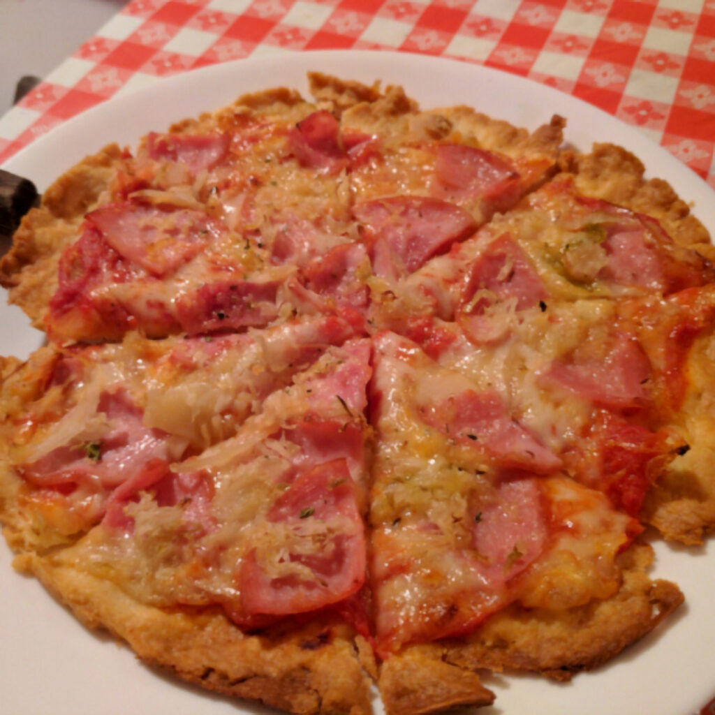 A graphic of a thin crust Swisseroo pizza with kraut.